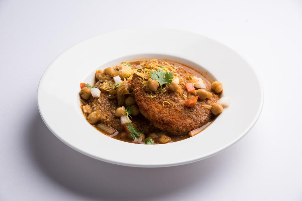 bowl of stew with chickpeas in white bowl