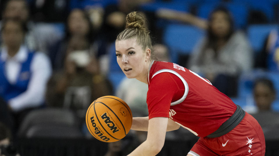 FILE - UNLV guard Ashley Scoggin (0) dribbles during an NCAA basketball game against Creighton, March 23, 2024, in Los Angeles. Former Nebraska assistant Chuck Love, in his answer to a civil lawsuit filed in February by former Nebraska player Ashley Scoggin, denied having a sexual relationship with Scoggin. (AP Photo/Kyusung Gong, file)