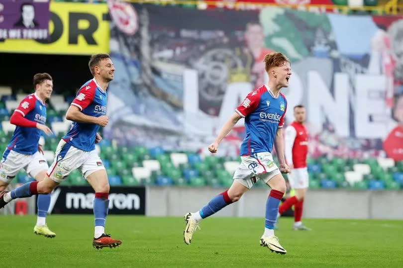 A picture of Braiden Graham celebrating Linfield's goal against Larne