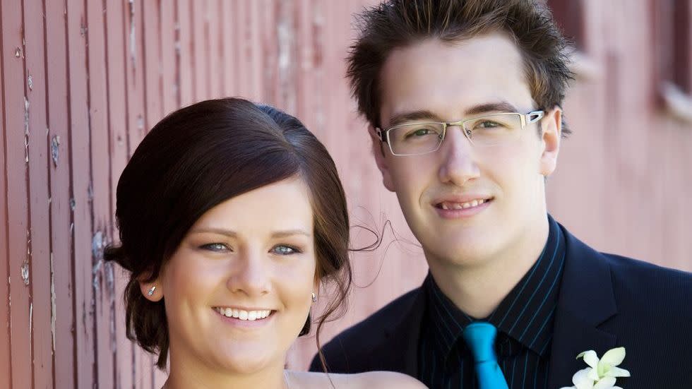 a man and woman posing for a picture