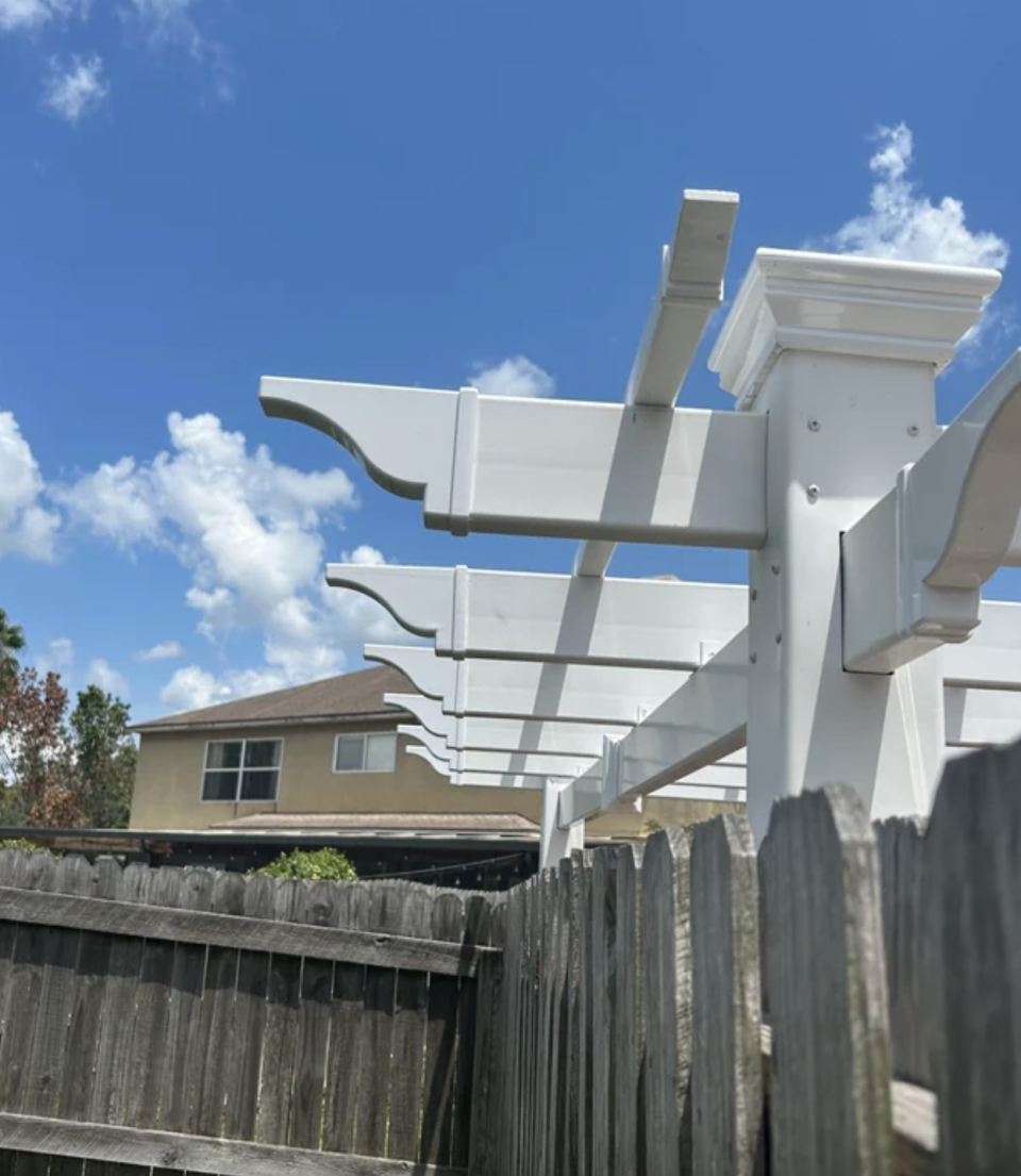 the inches of the pergola going over into the neighbor's yard