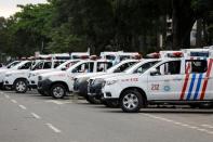 Police vehicles are seen parked during a protest in Lagos