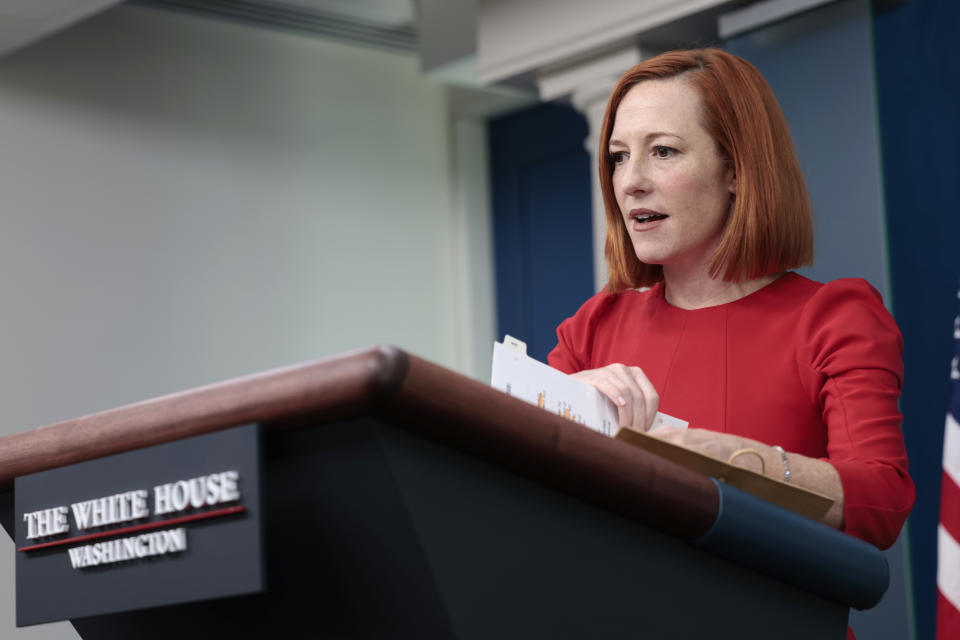 Then-White House press secretary Jen Psaki stands at a podium.