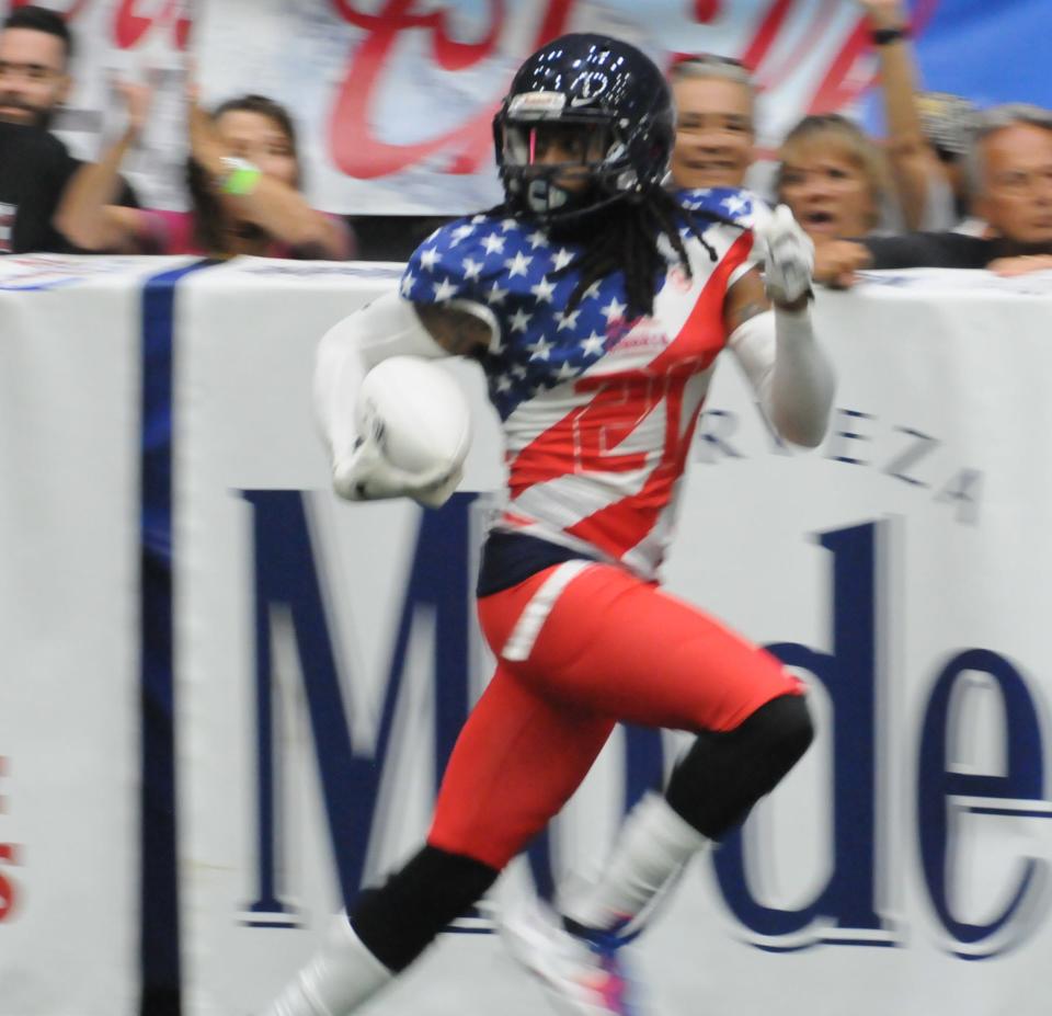 Salina's Evan Ray returns an interception during Champions Bowl VII Saturday at Tony's Pizza Events Center.