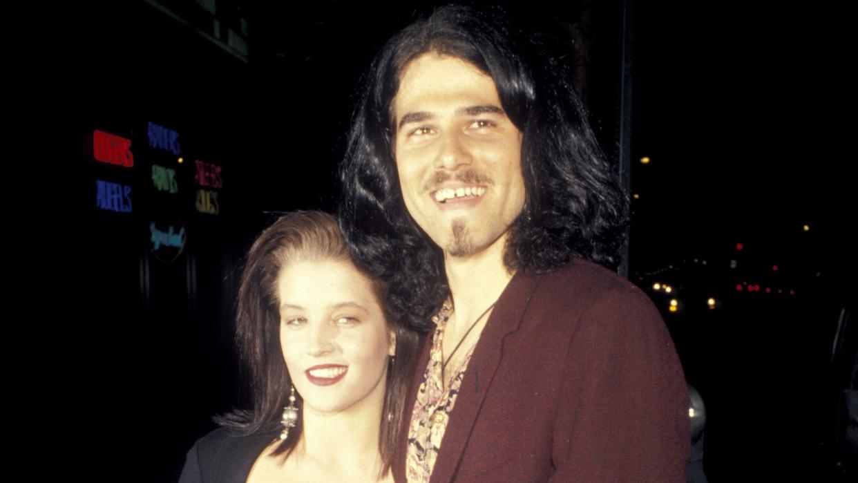 lisa marie presley and husband danny keough embracing and smiling for a photo