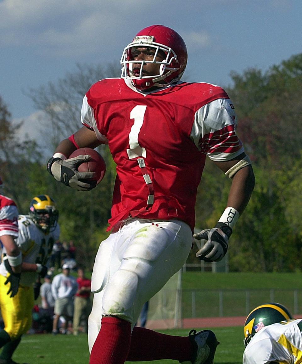 Kevin Smith Jr., who went on to star as a linebacker for Syracuse before playing that position in the NFL, was also a big offensive contributor  in high school. Here he picks up yardage during an Oct. 20, 2001 game vs. Ramapo.