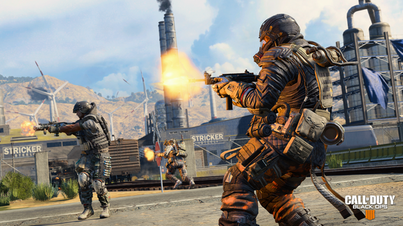 Screenshot of Activision's Call of Duty Black Ops 4 game depicting two in-game soldiers standing in an industrial area and firing weapons.