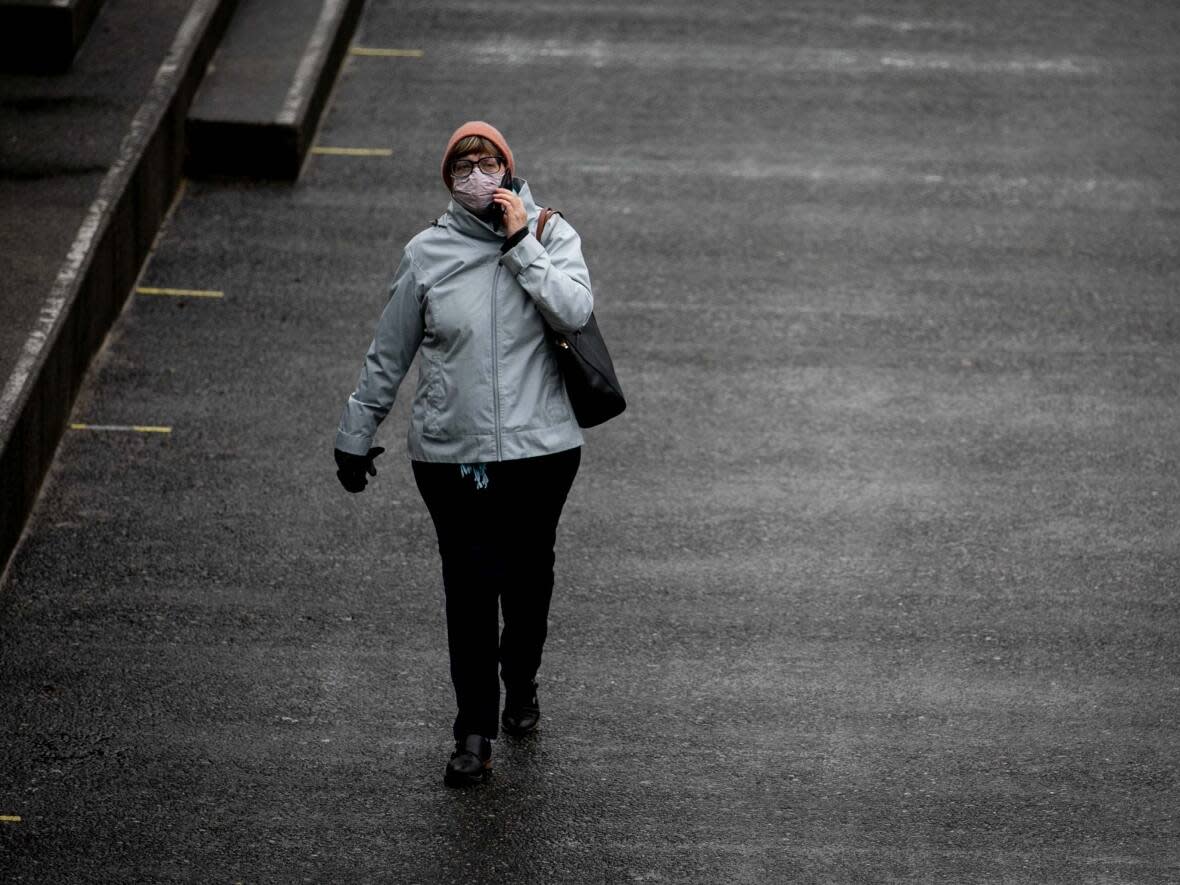 A pedestrian in Victoria pictured in October. (Ken Mizokoshi/CBC - image credit)