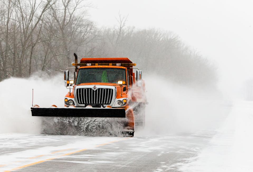 A snow plow heads east along along Spaulding Orchard Road with temperatures hovering around 2 degrees in Springfield, Ill., Monday, February 15, 2021. The City of Springfield's Office of Public Works announced a Snow Emergency will be in effect on designated snow routes starting at 12:00 p.m. Monday, February 15th and ending at 7:00 a.m. Friday, February 19th. [Justin L. Fowler/The State Journal-Register]