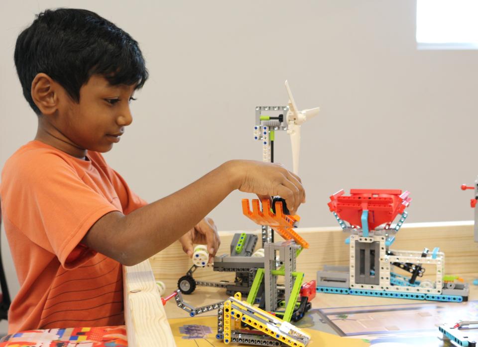 Dhruv Vishnuvardhan, 7, plays with Legos at the Cox Science Center and Aquarium on Saturday, Sept. 17, 2022.