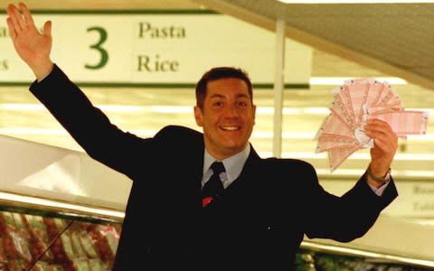 Dale Winton doing a 'Supermarket Sweep' in Brent Cross, London, to promote the midweek National Lottery. - Credit: Tony Harris /PA