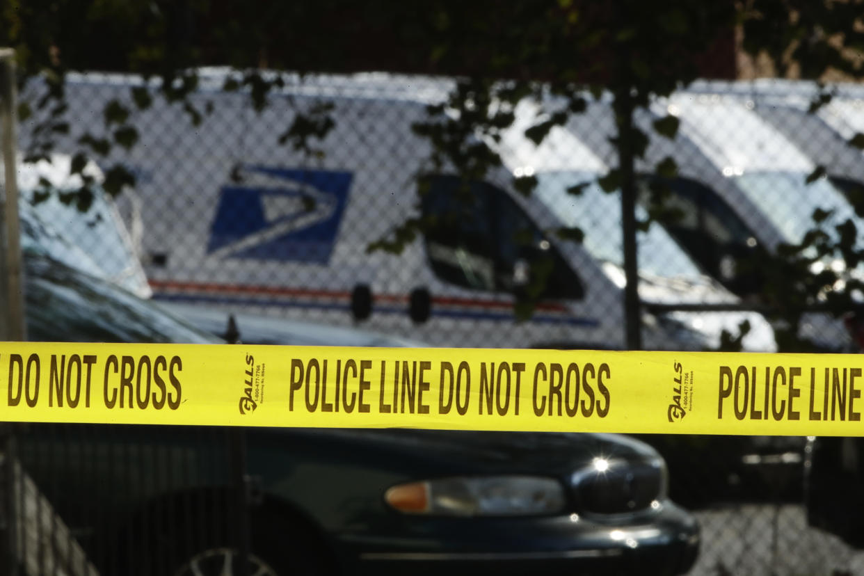 Police tape cordons off a post office in Wilmington, Del., on Thursday. (AP Photo/Matt Rourke)