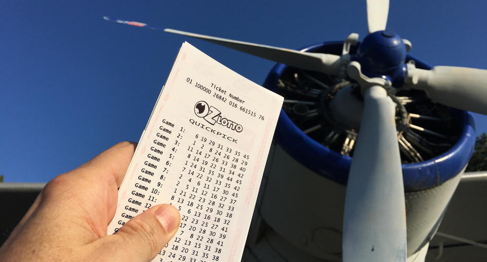 A winning Oz Lotto ticket winner about to board an airplane