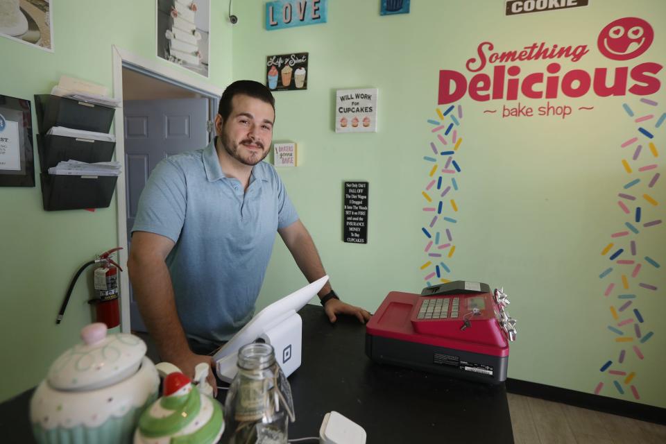 Phil Tomasso IV at Something Delicious Bake Shop at Erie Canal Commons in Greece on December 14, 2021, a bakery he owns with his wife.   Tomasso will be in a Guy Fieri Food Network show competition.