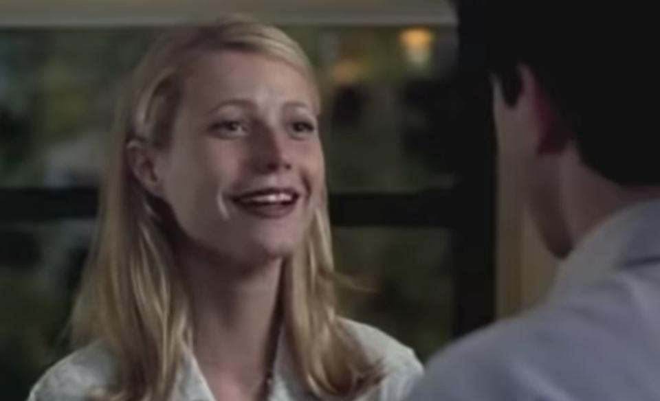 Gwyneth Paltrow smiles at a man who is offscreen.