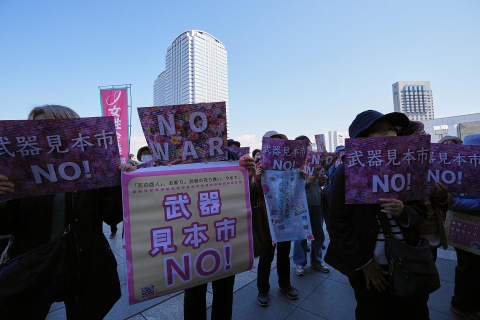 People protest in front of the   Makuhari Messe convention center in Chiba Prefecture, Japan, March 15, 2023, as hundreds of national and company delegations gathered inside for a military equipment show. / Credit: Zhang Xiaoyu/Xinhua/Getty