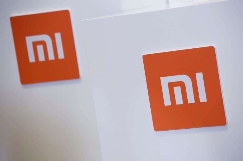 FILE PHOTO: Xiaomi logos are displayed during a news conference in Hong Kong