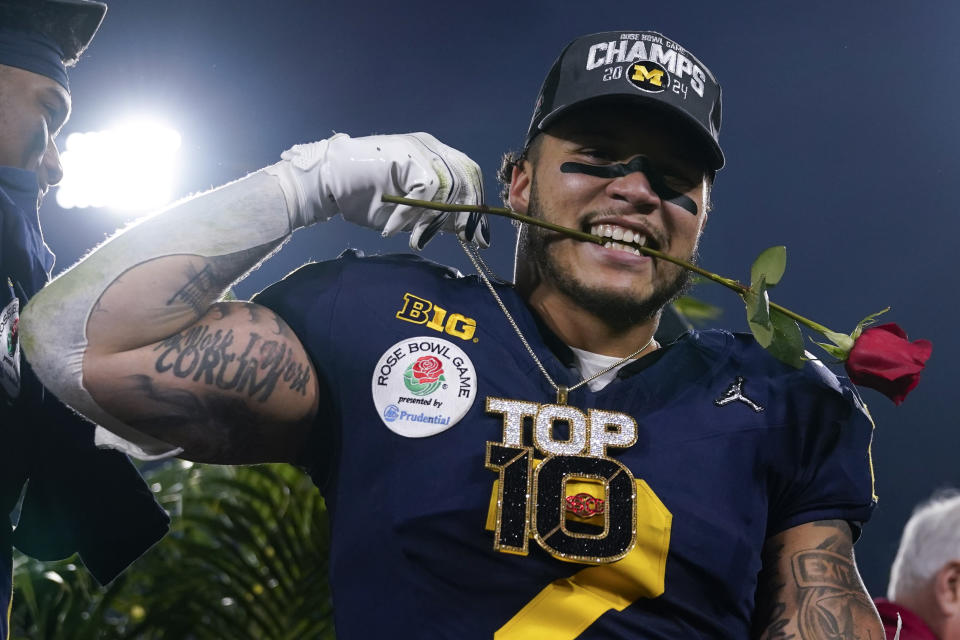 Michigan running back Blake Corum (2) celebrates after a win over Alabama in the Rose Bowl CFP NCAA semifinal college football game Monday, Jan. 1, 2024, in Pasadena, Calif. (AP Photo/Ryan Sun)