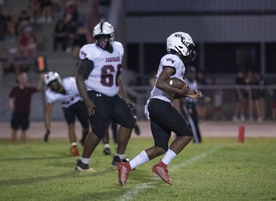 Marquez Jones (4) takes it in for a touchdown and a 19-7 Jaguars lead during the West Florida vs Navarre preseason football game at Navarre High School on Friday, Aug. 18, 2023.