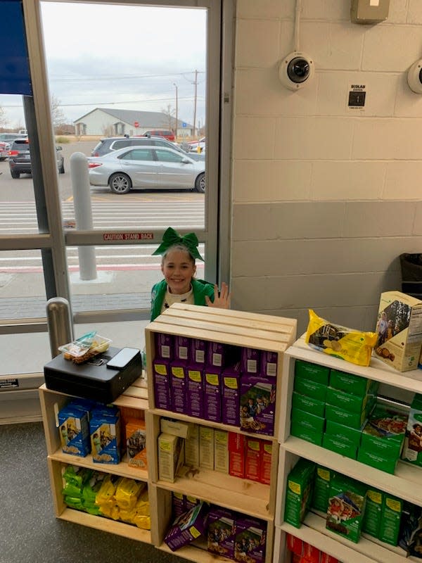 Girl Scout junior Layla Pontruff works to reach her goal of selling $2,300 worth of cookies for a GSTOP DIVE trip. Pontruff can be found selling cookies every other weekend at the Arden Road Walmart.