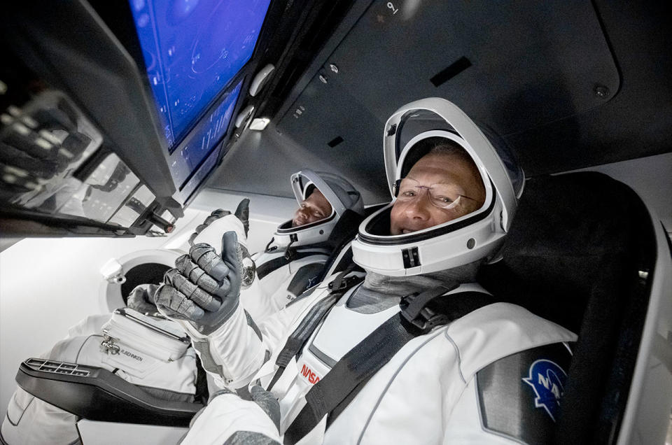 Astronauts Bob Behnken (left) and Doug Hurley on board SpaceX's Crew Dragon prior to the Demo-2 mission launch in 2020.