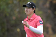 Yuka Saso, of Japan, acknowledges the crowd after making a putt on the 16th green during the third round of the Tournament of Champions LPGA golf tournament, Saturday, Jan. 22, 2022, in Orlando, Fla. (AP Photo/Phelan M. Ebenhack)