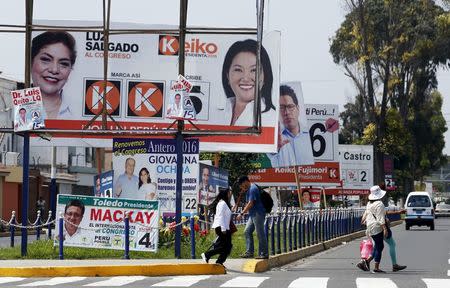 Electoral advertising is seen along a street in the Chorrillos district of Lima, Peru April 8, 2016. REUTERS/Mariana Bazo