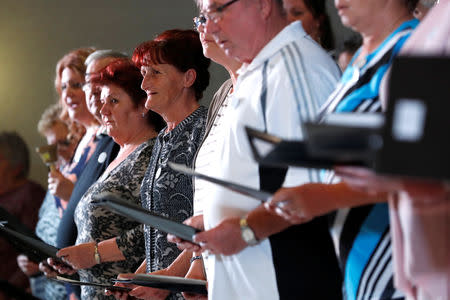 Members of the "Breathing for the Soul" choir, who are patients suffering from lung diseases, sing during their concert in Budapest, Hungary, November 15, 2018. Picture taken November 15, 2018. REUTERS/Bernadett Szabo