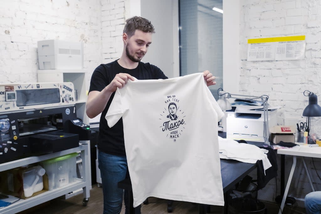 Kirill Karavaev in his T-shirt shop in Moscow with one bearing the message: “How About This Elon Musk?” (Photo for The Washington Post by Oksana Yushko)
