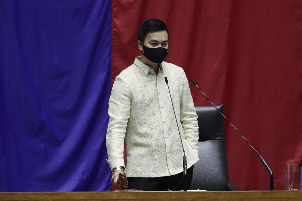 New House Speaker Lord Allan Velasco bangs the gavel during his first day at the House of Representatives in Quezon city, Philippines on Tuesday, Oct. 13, 2020. A large faction of Philippine legislators in the House of Representatives elected a new leader Monday in a tense political standoff between two allies of the president. (AP Photo/Aaron Favila)