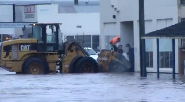 Locals pitching in on the ground. Source: 7News