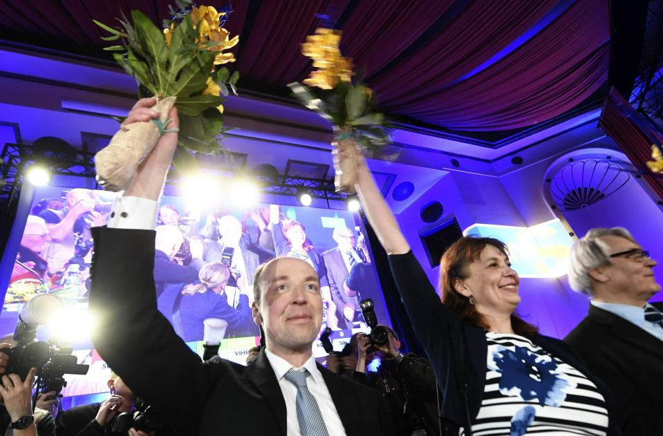 Chairman of The Finns Party Jussi Halla-aho, left, Party Secretary Riikka Slunga-Poutsalo and Campaign manager Ossi Sandvik, right, attend The Finns Party parliamentary election party in Helsinki, Finland on Sunday, April 14, 2019. (Vesa Moilanen/Lehtikuva via AP)