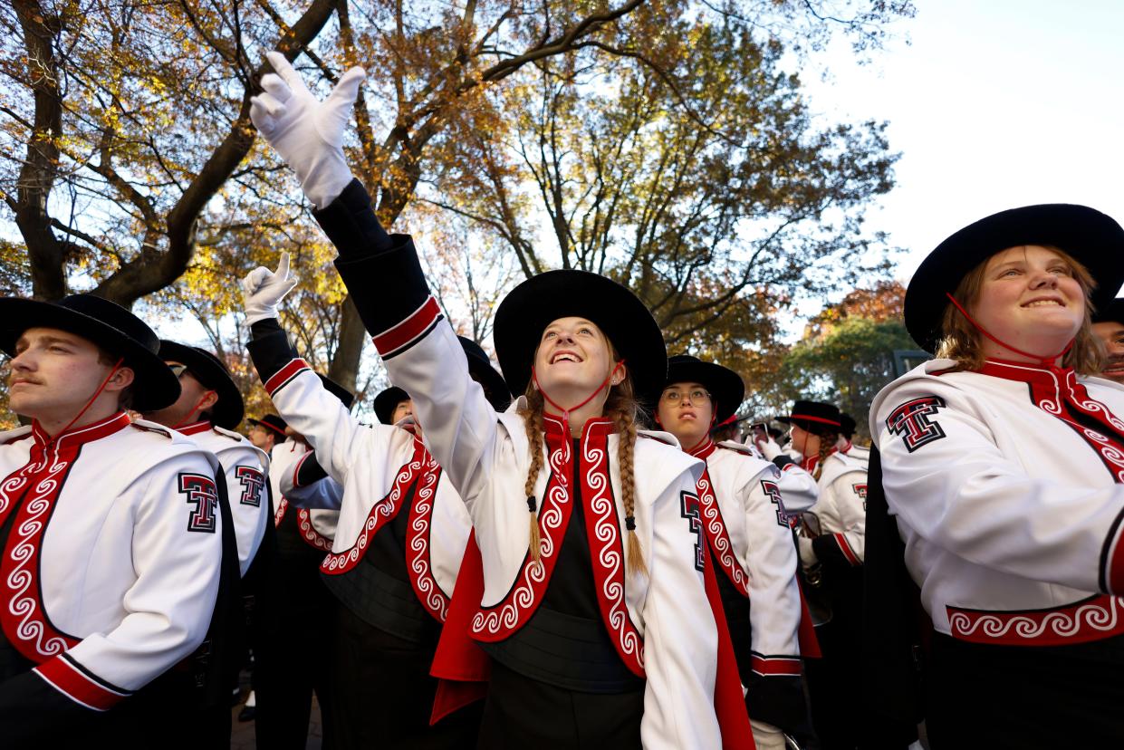 Goin' Band from Raiderland members show their "Guns Up" in New York City