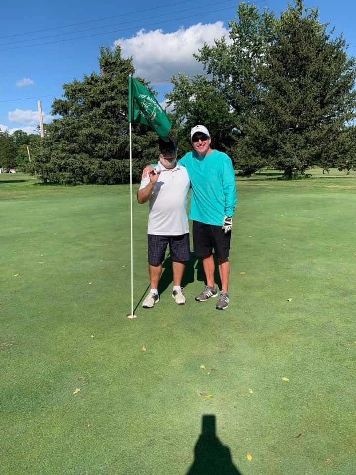 Mickey Rossi and Jim Henry after Rossi's hole-in-one on the par-3 fourth hold at Mahoning Country Club in Girard, Ohio.