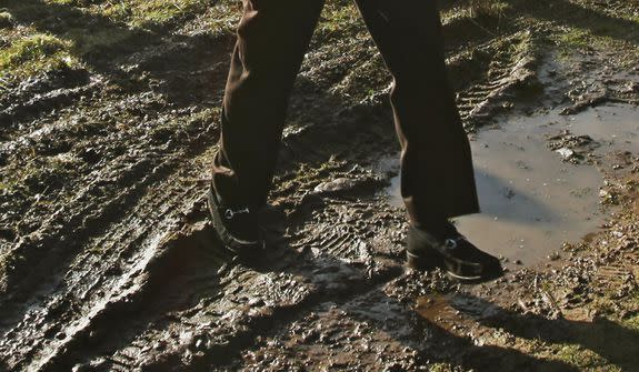 ABERDEEN, SCOTLAND - OCTOBER 28: Donald Trump Jr. walks through mud on the Menie estate on October 28, 2009 in Aberdeen, Scotland. Preparatory work started today on Donald Trump's golf project on the Menie Estate, north of Aberdeen, after councillors gave clearance for work to be carried out to stabilize sand dunes in the area of the proposed site. However, some local residents are strongly opposed to it and are refusing to sell their homes on the land where Trump Snr. plans to build a billion-pound resort which will feature two golf courses, a hotel and some 1,000 holiday homes. (Photo by Jeff J Mitchell/Getty Images)