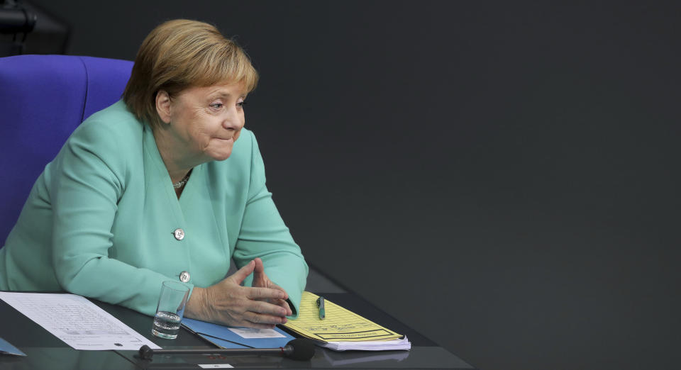 German Chancellor Angela Merkel attends a meeting of the German federal parliament, Bundestag, at the Reichstag building in Berlin, Germany, Thursday, Sept. 26, 2019. (AP Photo/Michael Sohn)