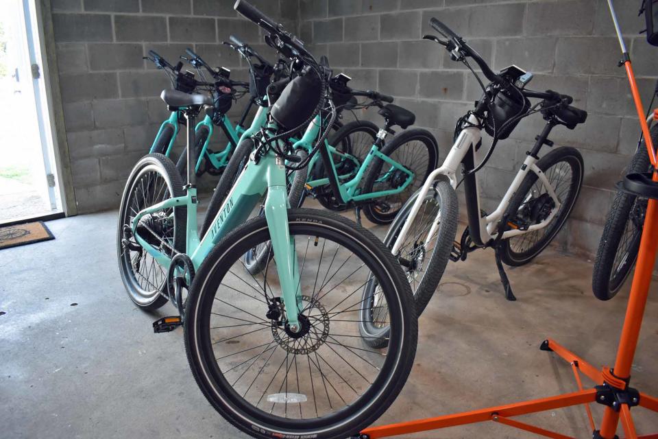 Electric bikes await customers at Local Spokes in Slater. The business rents e-bikes and is also a dealer for new and used models.