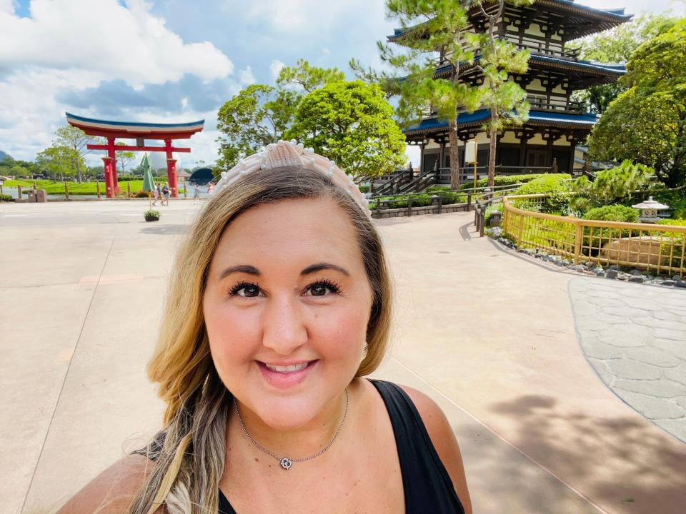 carly in front of the japan pavilion at epcot