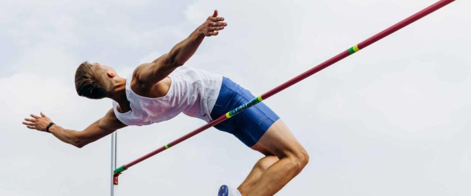 high jump athlete jumper successful attempt in competition