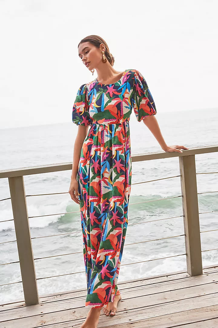 woman wears patterned Beach Riot Weston Open-Back Dress by the ocean