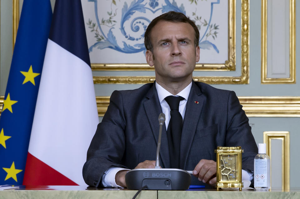 French President Emmanuel Macron attends a Climate Summit video conference, at the Elysee Palace, in Paris, France, Thursday, April, 22, 2021. (Ian Langsdon/ Pool photo via AP)