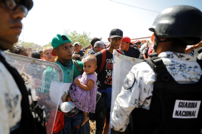 Large migrant caravan prepares to enter Mexico from Guatemala