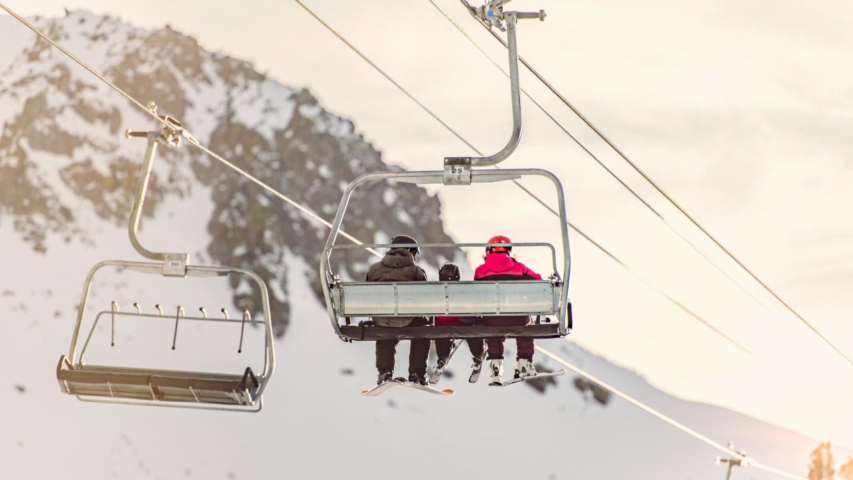  Family Of 3 Riding Ski Lift. 