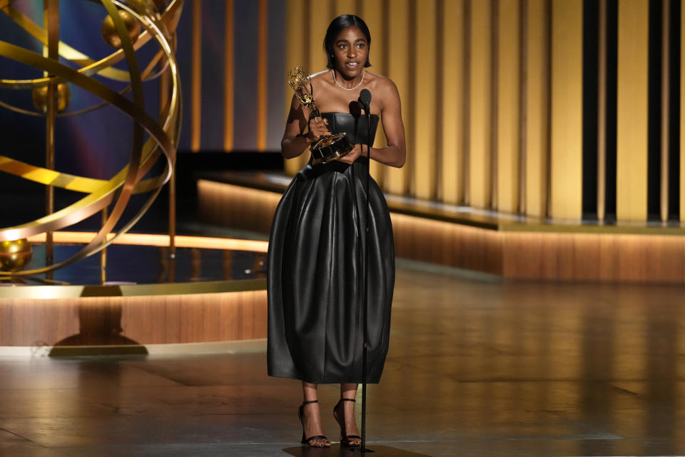 Ayo Edebiri accepts the award for outstanding supporting actress in a comedy series for "The Bear" during the 75th Primetime Emmy Awards on Monday, Jan. 15, 2024, at the Peacock Theater in Los Angeles. (AP Photo/Chris Pizzello)