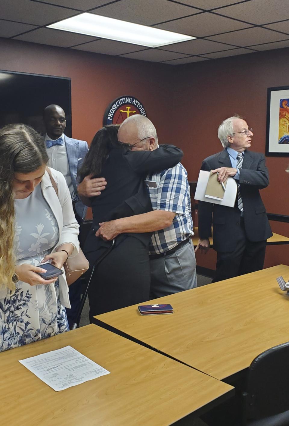 Jeff Titus hugs his attorney Mary Chartier after learning he will not face a second trial for double murder. A federal judge overturned the 2002 convictions in Feb. 2023. Kalamazoo County Prosecutor Jeff Getting said at a news conference on Thursday, June 1, 2023, that he decided to not proceed with a new trial. (Marie Weidmayer/Kalamazoo Gazette via AP)