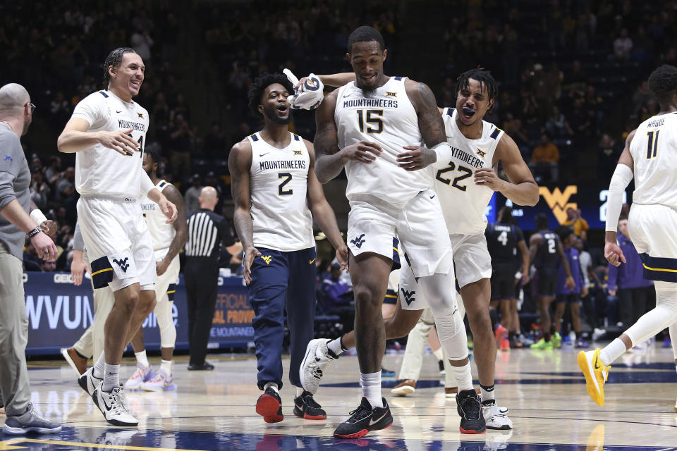 West Virginia players celebrate during the first half of the team's NCAA college basketball game against TCU on Wednesday, Jan. 18, 2023, in Morgantown, W.Va. (AP Photo/Kathleen Batten)