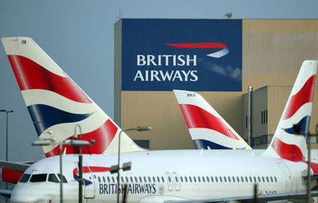 FILE PHOTO: British Airways aircraft are seen at Heathrow Airport in west London, Britain, February 23, 2018. REUTERS/Hannah McKay/File Photo