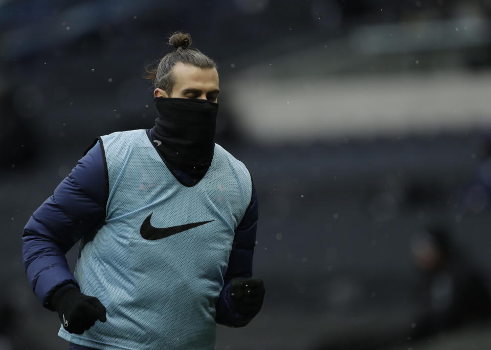 Tottenham's Gareth Bale warms up during the English Premier League soccer match between Tottenham Hotspur and West Bromwich Albion at the Tottenham Hotspur Stadium in London, Sunday, Feb. 7, 2021. (AP Photo/Matt Dunham, Pool)