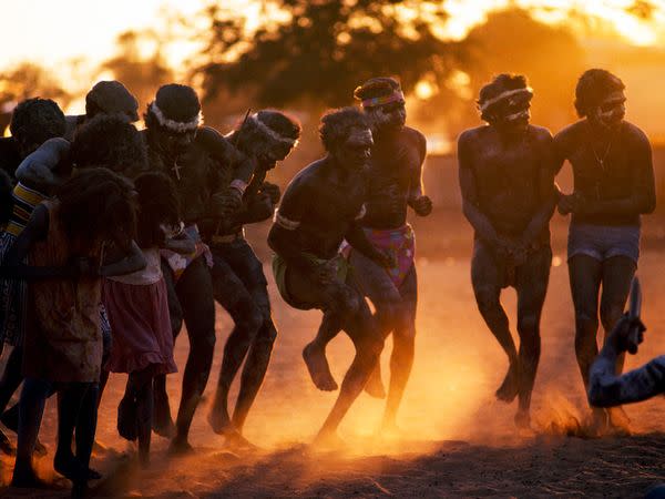 Aborigines kick up dust in a dance at sunset. The original inhabitants of Australia, Aborigines were there for more than 40,000 years before white men arrived. European settlers brought disease and politics to the continent, severely endangering the Aborigines’ distinct culture, language, and lifestyle.