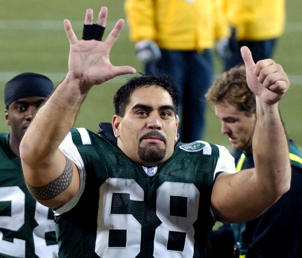 New York Jets center Kevin Mawae signals to the fans as he leaves the field after the Jets beat the Miami Dolphins 41-14 Monday night, Nov. 1, 2004 at Giants Stadium in East Rutherford, N.J. The Jets are 6-1 on the season tied for first place in the AFC East with the New England Patriots.  (AP Photo/Bill Kostroun)